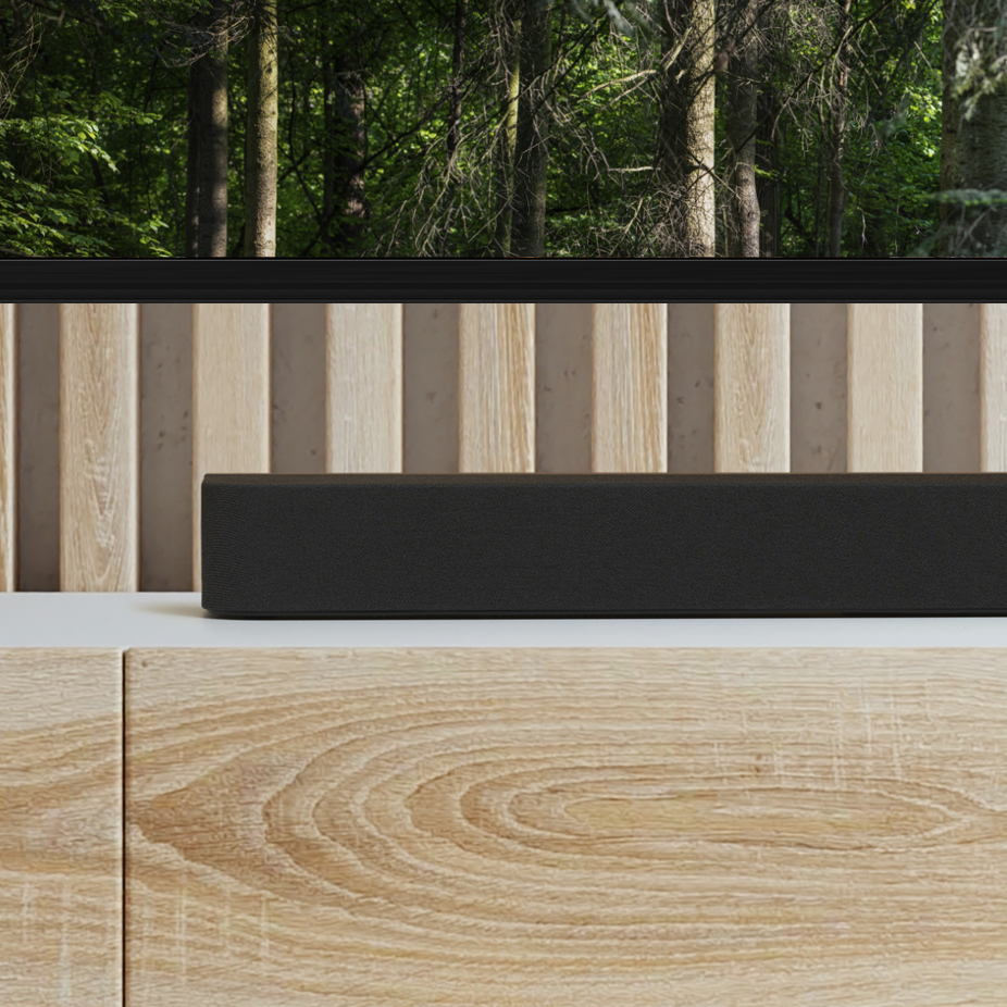 オーディオラックにサウンドバー、テレビが設置されている