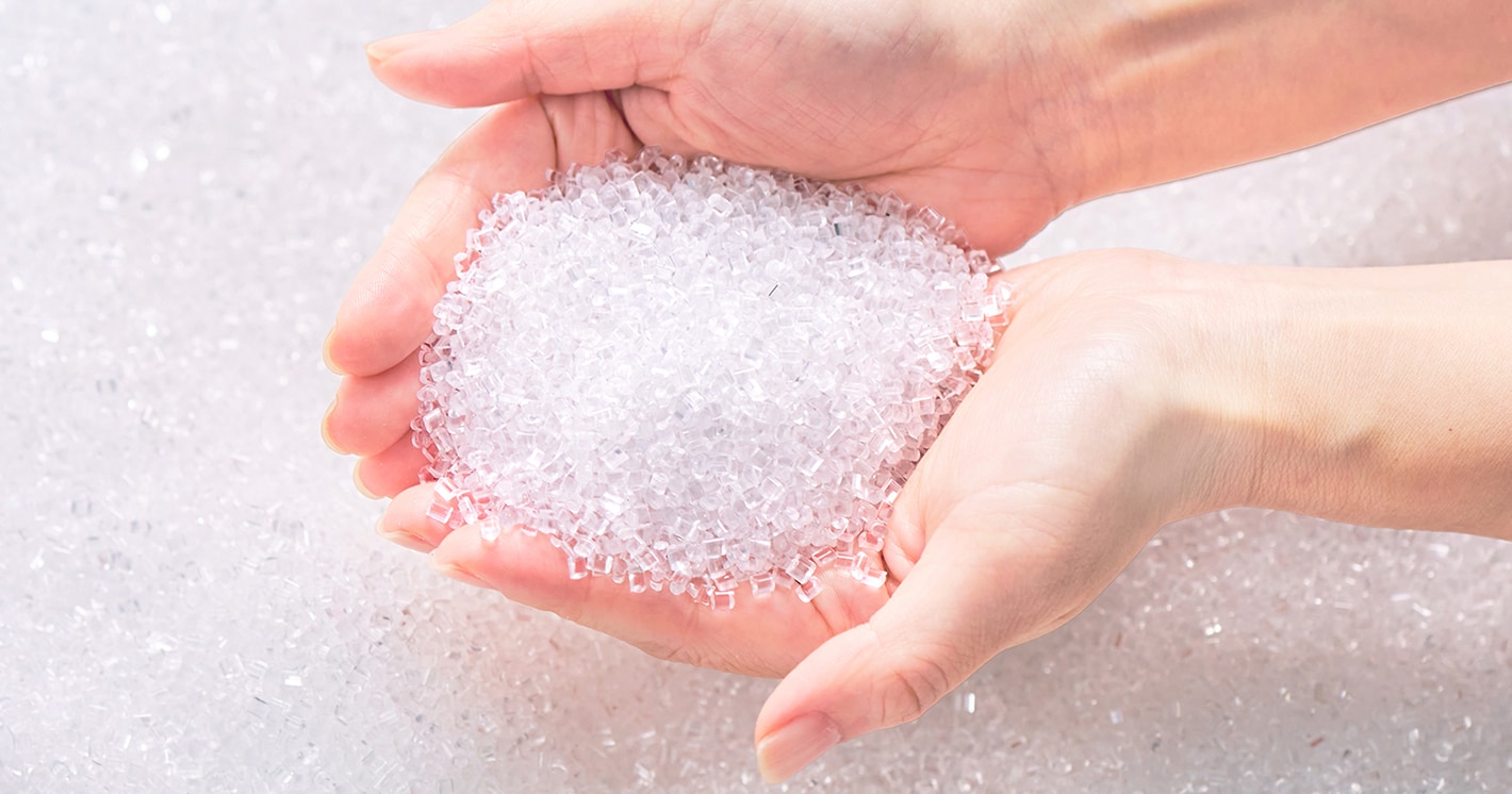 Scooping plastic resin pellets by hand