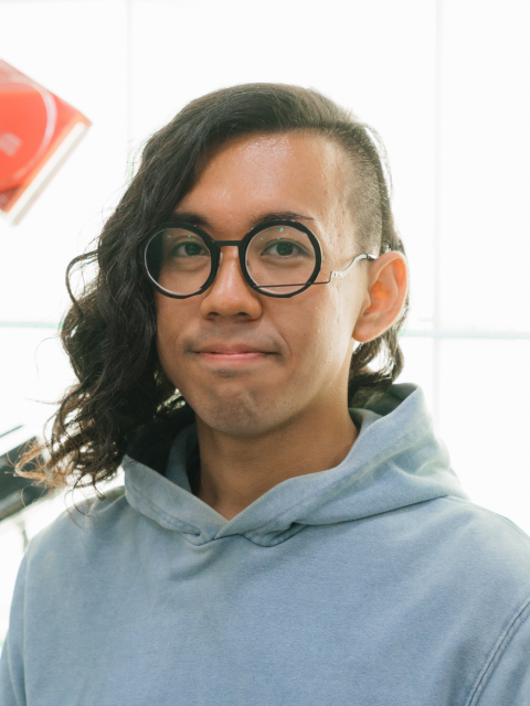 Photo of Rin Ito smiling and sitting