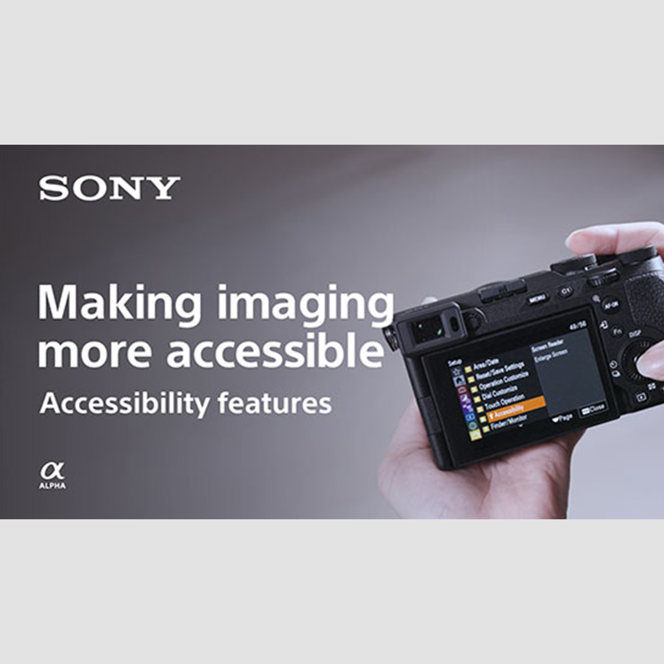 Rear view of camera being hand-held with right thumb operating control dial, and LCD monitor displaying menu screen