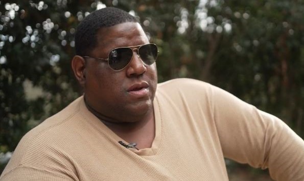 Portrait of Nate Barnes wearing sunglasses